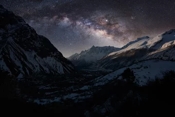 Papier Peint photo Everest Night landscape of Himalayas with the colorful Milky Way full of stars. Manaslu trek in Nepal.