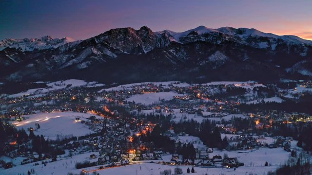 Sunset over snowy Zakopane in winter, aerial view