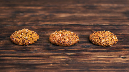 Oatmeal cookies on a dark wooden table_