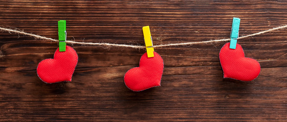 Handmade red heart attached to the rope using clothes pin. Valentine's Day card_