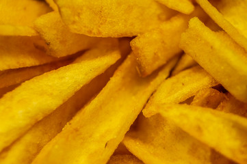 Deep-fried potato chips close-up. Macro photo