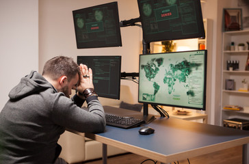 Side view of dangerous hacker with eyes closed