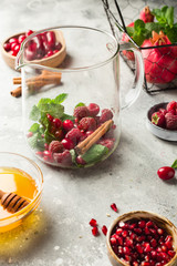 Vitamin tea withe red berries, mint and lemon