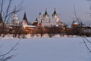 Fototapeta premium winter frosty morning with a view of the lake and the ancient fortress