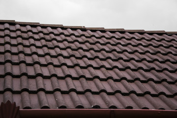 Close up of roofing tiles. Roof of new house. Roof tiles background