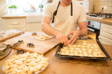 Young man bakes cookies