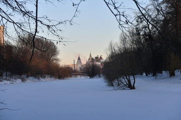 winter frosty morning with a view of the lake and the ancient fortress