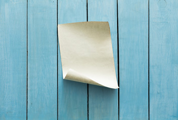 old paper on blue wall