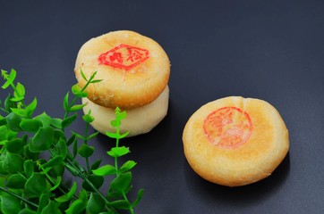 Traditional Chinese food moon cake on black background