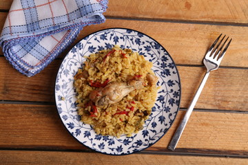 plate of rice with chicken and peppers