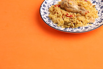 plate of rice with chicken and peppers