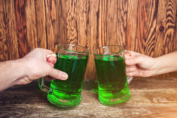 Friends toast with each other. Saint Patrick's day party.