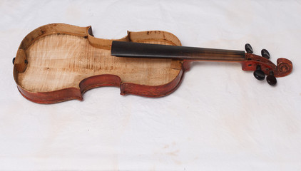 Broken antique red violin for restoration with damage