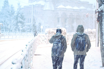 Eskisehir / Turkey-January 06, 2020; Silhouette of the students returning from school, as education was interrupted due to unfavorable weather conditions. snow break. Schools holidays due to snowfall.