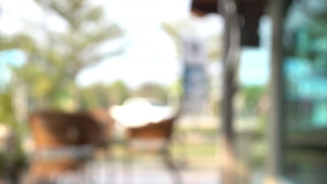 blur scene outdoor cafe with table seat outside garden view in the morning