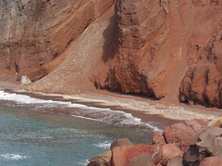 Red beach near the city of Akrotiri on Santorini island, Greece.