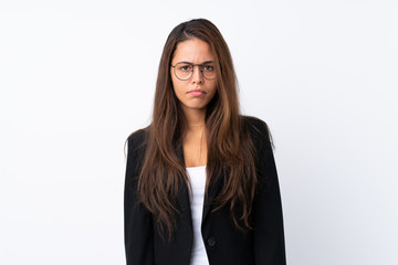 Young Brazilian girl with blazer over isolated white background sad