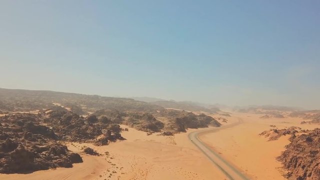 Saudi Arabia, Tambuk region. Aerial view of the desert and mountain landscape, the road going to Al Ula