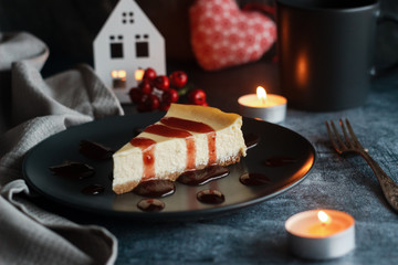 Cheesecake on a plate with strawberry sauce