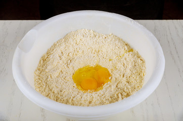 Ingredients of cookie dough egg, sugar, butter and flour.