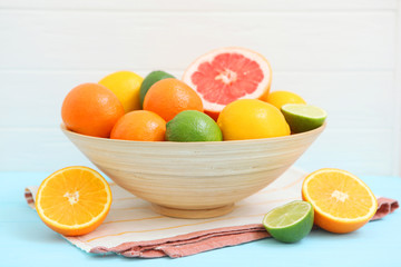 Different citrus fruits on the table. Juicy citrus fruits.