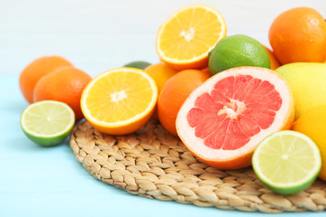 Different citrus fruits on the table. Juicy citrus fruits.