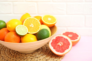 Different citrus fruits on the table. Juicy citrus fruits.