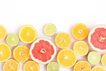 Fototapeta na wymiar Different citrus and juicy slices on a light background top view. Place to insert text.