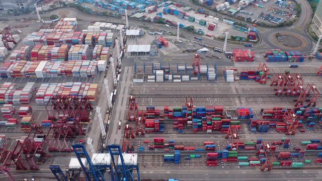 Container terminal from above, many containers, cranes and loading equipment