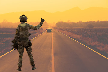 Soldier with machine gun patrolling 