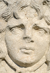 Fototapeta na wymiar face of ancient statue