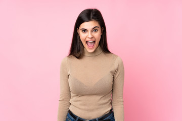 Young woman over isolated pink background with surprise facial expression