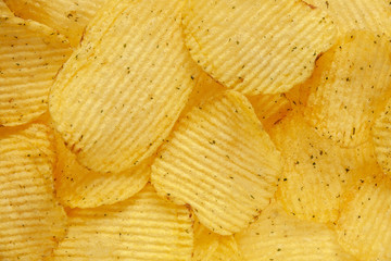 food background of fluted chips with dill