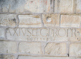 sign on a historical wall