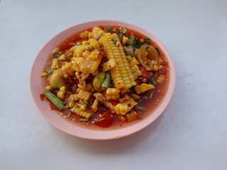 Thai food corn papaya salad or SOM TUM   on wood background, 