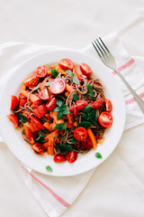 delicious Italian pasta with tomatoes, carrots and Basil on a white napkin