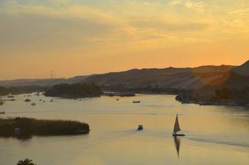 Beautiful sunset and sun-ray , Sand dunes on the Coastline of the Nile river part called First Cataract, Aswan, Egypt