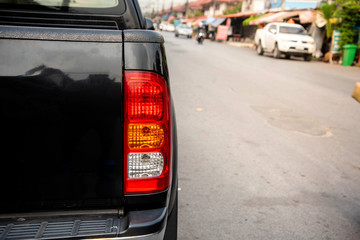 Rear light of the back of a pickup truck, black © chalermphon