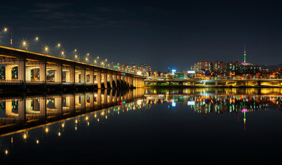 Seoul cityscape bridges, buildings and lights at night along the Han River