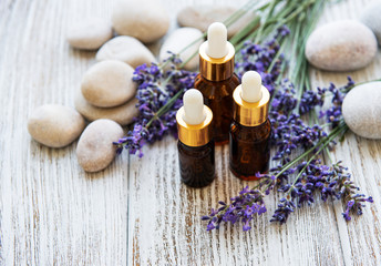Obraz na płótnie Canvas Lavender oil and lavender flowers
