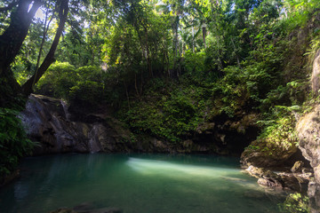 Hidden in jungles Ingkumhan waterfalls, popular tourist attraction in Dimiao, Bohol, Philippines