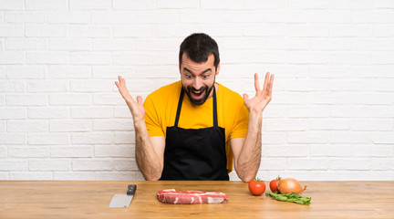 Chef in a cuisine making surprise gesture