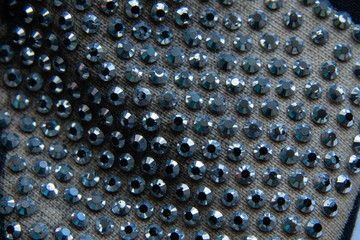 rhinestones on fabric closeup as background