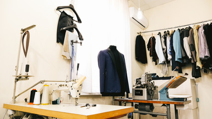 Sewing workshop, solar studio. Colored fabrics, clothes visible.