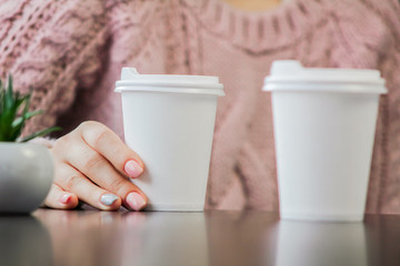 woman holding a cup of coffee