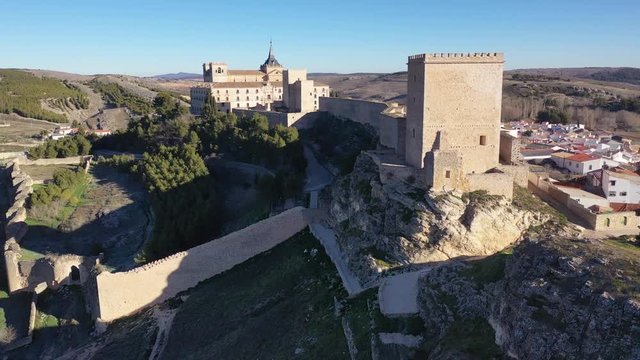 Aerial footage of circling the walls of Ucles castle and monastery in Cuenca Spain