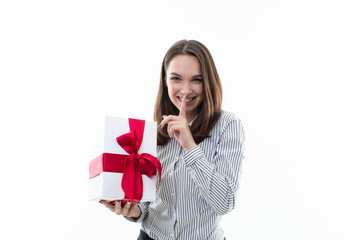 The girl makes a surprise by giving a box with a gift