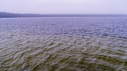 Panorama of a winter cold lake. Loneliness concept.