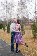 Fototapeta premium couple in love walks in autumn park