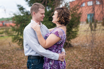 Fototapeta premium couple in love walks in autumn park